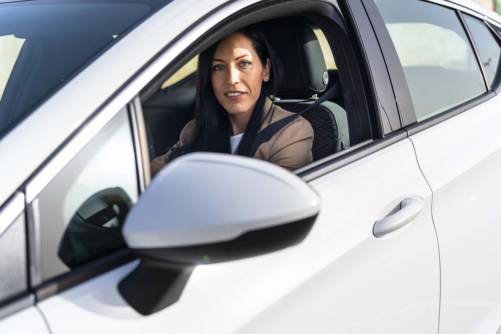 Executive Travel: Businesswoman Renting a Luxury Car at Airport