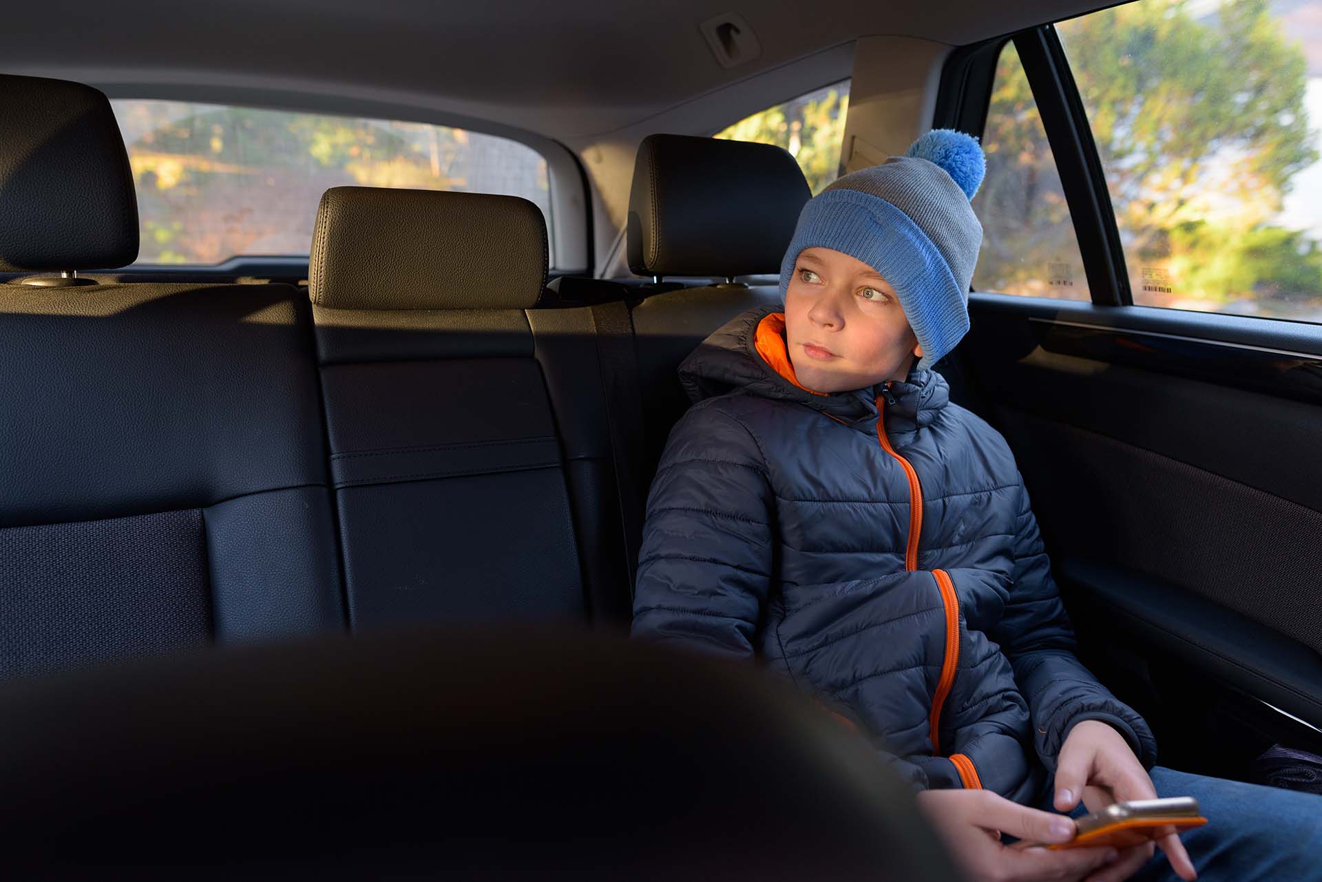 Portrait of young handsome boy ready for road trip in Finland