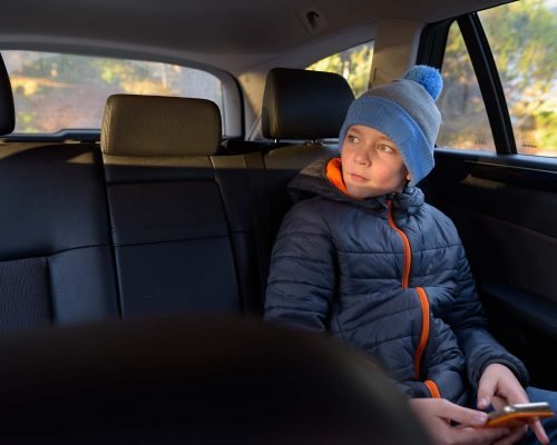 Portrait of young handsome boy ready for road trip in Finland